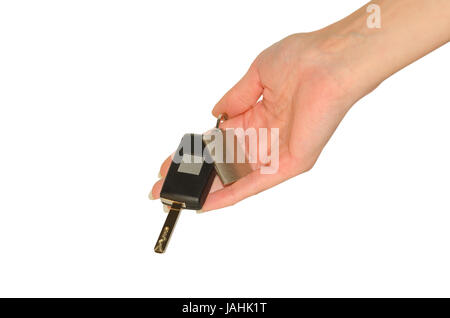 Elegante zarte Frauenhand mit neuen Autoschlüssel und Schlüsselbund isoliert auf weiss Stockfoto