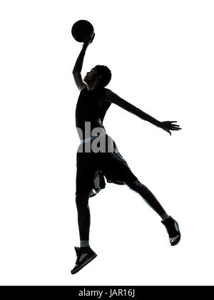 ein junger Mann Basketballspieler dunking Silhouette im Studio isoliert auf weißem Hintergrund Stockfoto