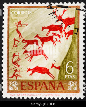 Spanien - CIRCA 1967: Eine Briefmarke gedruckt in Spanien-Felsmalereien in den Höhlen von Spanien - Jagdszene in Los Caballos Canyon, circa 1967 Stockfoto