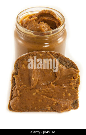 Bild von einer Dose Peanut Butter und eine Scheibe Brot mit Erdnussbutter drauf Stockfoto