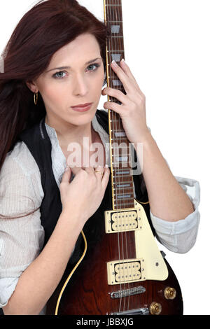 Frau mit einer e-Gitarre Stockfoto