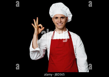 Fröhliche Koch zeigen perfekte Geste Stockfoto