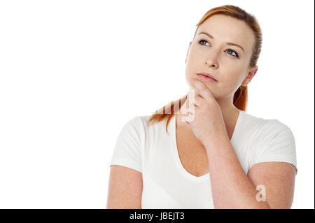 Junge Frau von etwas wirklich schwer zu denken. Stockfoto