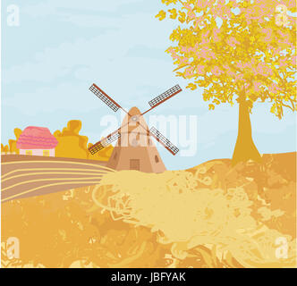 Landschaft mit Windmühle im sonnigen Herbsttag Stockfoto