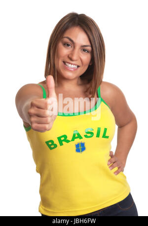 Attraktive Brasilianerin zeigen Daumen und Lachen in die Kamera auf einem isolierten weißen Hintergrund Stockfoto