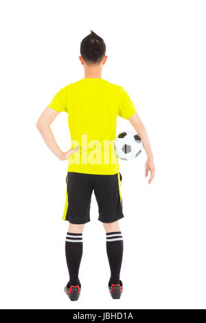 Fußballspieler, Fußball neben Taille Stockfoto