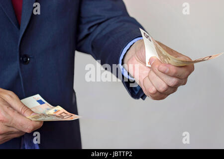 Mann Hand Geld Stockfoto