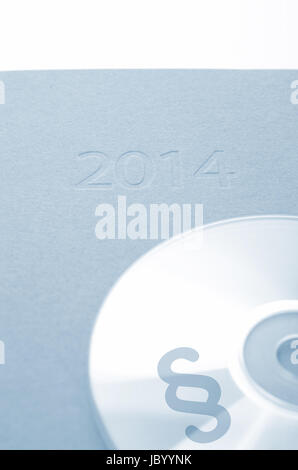 CD mit einem Absatz Symbol auf einen Kalender 2014 Stockfoto