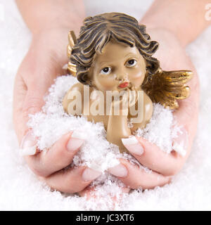 Weihnachtsengel - Frau ist sie in ihren Händen halten Stockfoto
