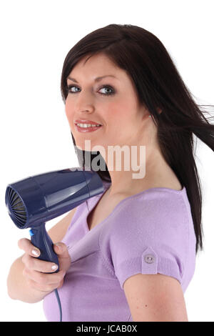 Frau mit einem Haartrockner Stockfoto
