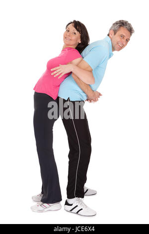 Aktive ältere paar Fitness zu tun. Isoliert auf weiss Stockfoto
