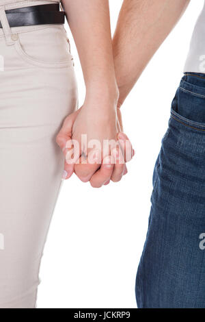 Junges Paar Hand in Hand isoliert auf weißem Hintergrund Bild beschnitten Stockfoto