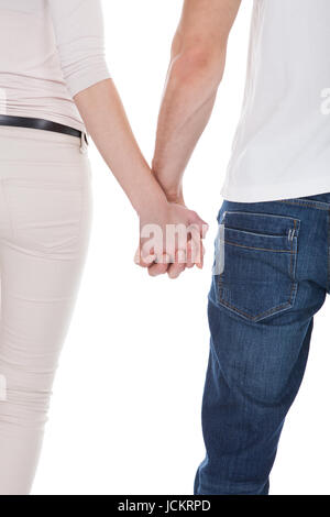 Junges Paar Hand in Hand isoliert auf weißem Hintergrund Bild beschnitten Stockfoto