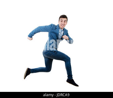 Geschäftsmann, laufen und springen über Hindernis mit einem ängstlichen Ausdruck. Stockfoto