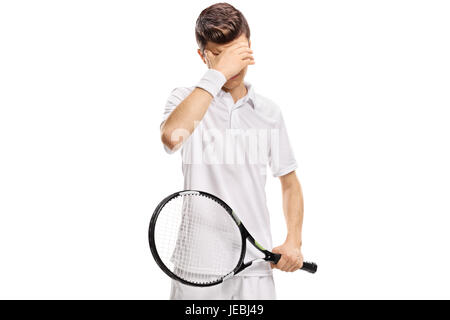 Teenager Tennisspieler hielt seinen Kopf ungläubig isoliert auf weißem Hintergrund Stockfoto