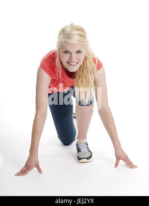 Frau in Startposition Stockfoto