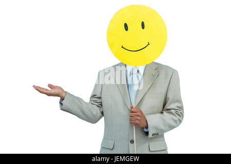 Geschäftsmann mit glücklichen Smiley-Gesicht-Ballon Stockfoto