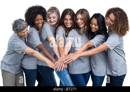 Glücklich Freiwilligen setzen Sie ihre Hände zusammen Stockfoto