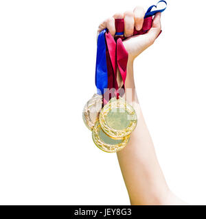 Hand mit drei Medaillen Stockfoto