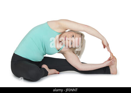 Yoga Frau grün Position 119 Stockfoto