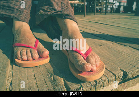 Fuß in Tangas Stockfoto