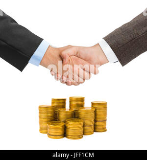 Händedruck und Goldmünzen Stockfoto