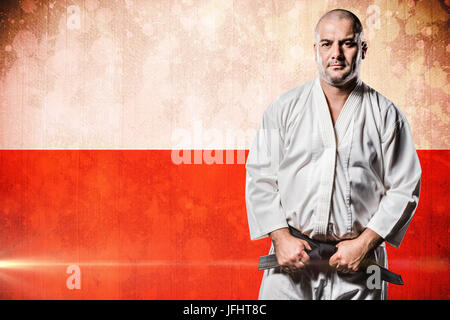 Das zusammengesetzte Bild im Fighter Anzug Karate Gürtel Stockfoto