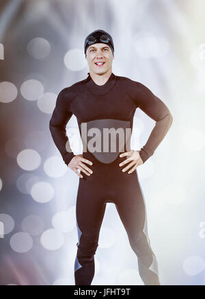 Zusammengesetztes Bild des Porträts von zuversichtlich Schwimmer im Neoprenanzug Stockfoto