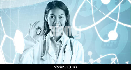 Zusammengesetztes Bild des asiatischen Arzt tun ok Sign. Stockfoto