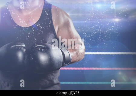 Zusammengesetztes Bild des Innenfeldes von muskulösen boxer Stockfoto