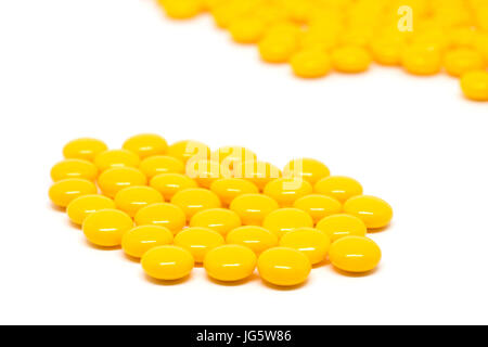 gelbe Zucker beschichtete Tabletten Pillen Stockfoto