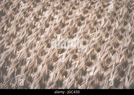 Gestrickte wollene braune Struktur Hintergrund. Makro, Nahaufnahme Toned Stockfoto