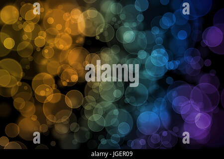 Perfekte Runde Bokeh Hintergrund mit gelb, orange, blau, grün und lila Ton auf schwarzem Untergrund. Stockfoto