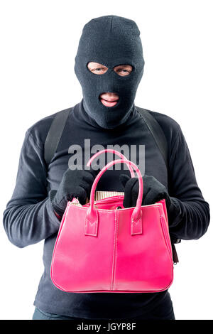 Verbrecher mit einem rosa Tasche auf der Suche nach wertvollen Sachen auf weißem Hintergrund Stockfoto