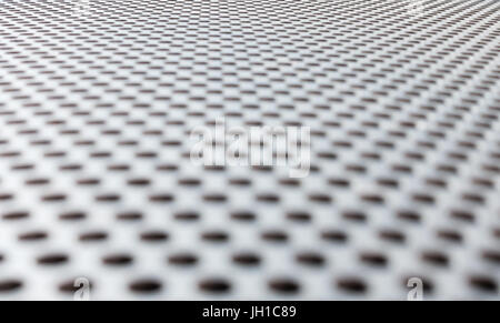 Grau Metall Hintergrund, runde perforiertes Metall Textur. Reflexionen und verwischen. Stockfoto