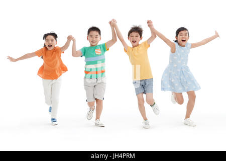 Fröhliche Schule Schüler Hand in hand laufen Stockfoto