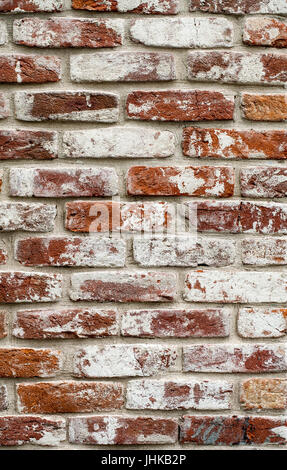 Roten Backsteinmauer weiß lackiert. Textur, Hintergrund, Design. Stockfoto