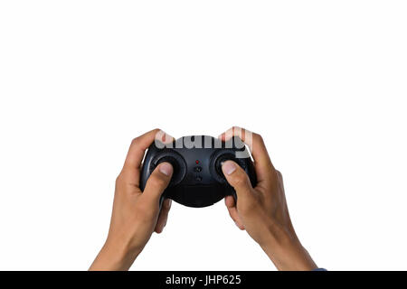 Bild von Hand mit Controller vor weißem Hintergrund abgeschnitten Stockfoto