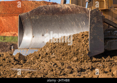 Bau Industrie Erdarbeiten Dozer Eimer Closeup Sand Steinen C abstrakt. Stockfoto