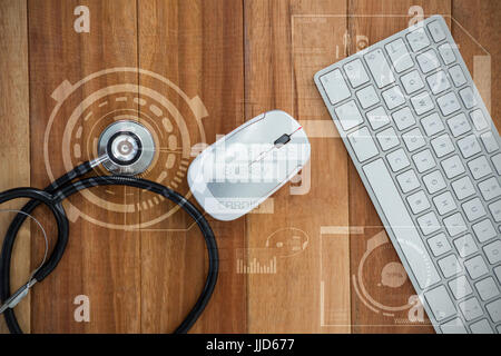 Stoffwechsel-Abbildung über schwarzen Hintergrund gegen Draufsicht des Stethoskop mit Tastatur und Maus Stockfoto