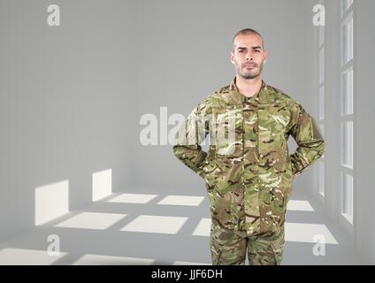 Digitalen Verbund der Soldat mit den Händen am Rücken. Konkreten Raum mit Fenstern Stockfoto
