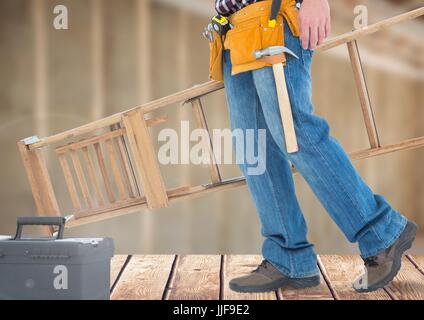 Digitalen Verbund von Bauarbeiter mit Leiter vor Baustelle Stockfoto