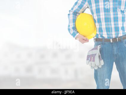 Digitalen Verbund von Bauarbeiter mit Helm vor Baustelle Stockfoto