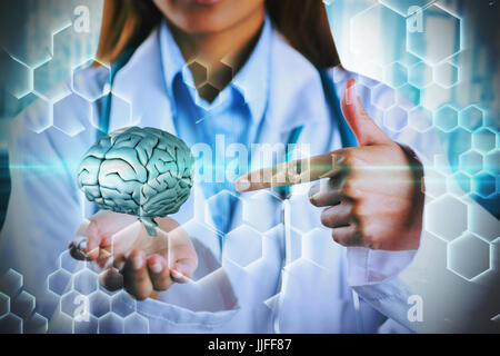 Mittleren Bereich der Ärztin zeigt leere Hand gegen chemische Struktur in blau und schwarz Stockfoto