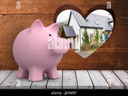 3D Rosa Sparschwein vor Holz mit Herz Loch wir ein Haus blau door(blurred) finden Stockfoto