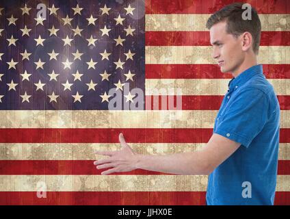 Mann schüttelte seine Hand gegen amerikanische Flagge Stockfoto
