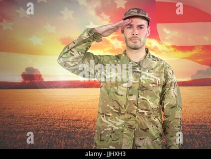 Militärische salutieren gegen Landschaft Sonnenuntergang Stockfoto