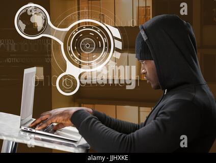 Seitenansicht der Hacker mit einem Laptop vor Gebäude Stockfoto