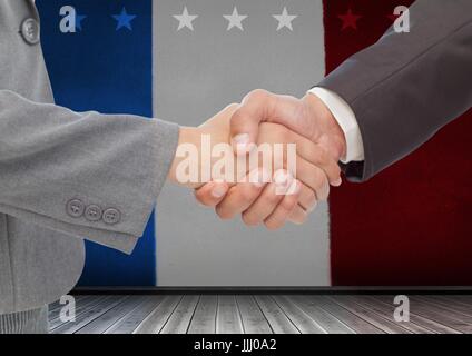 Geschäftsleute, die ihre Hand gegen die amerikanische Flagge Stockfoto