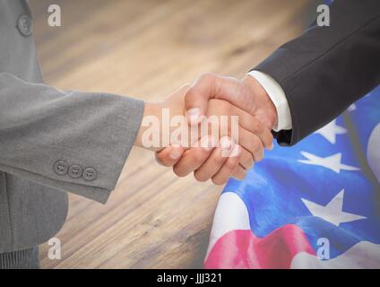 Geschäftsleute, die ihre Hand gegen die amerikanische Flagge Stockfoto